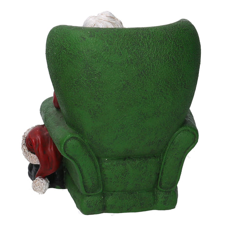 Santa Claus asleep on the armchair