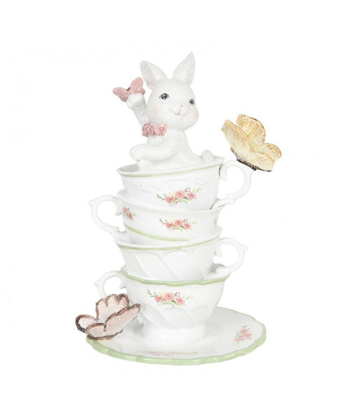 Figurine with cup and butterflies