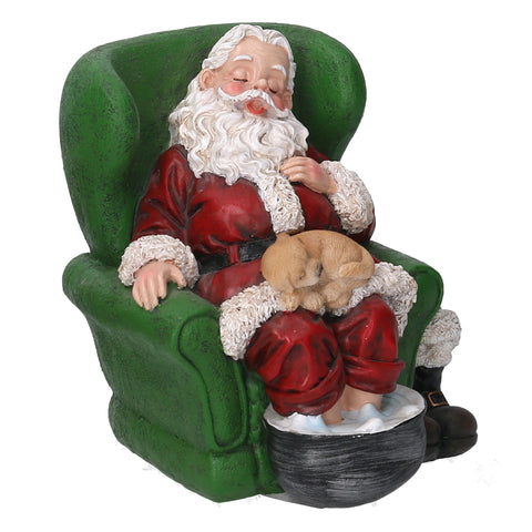 Santa Claus asleep on the armchair