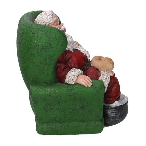 Santa Claus asleep on the armchair