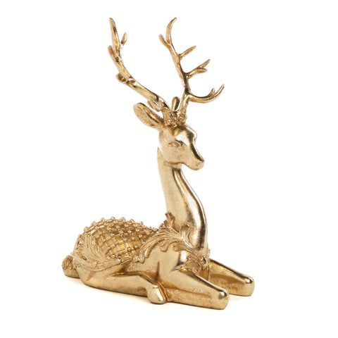 Christmas decoration deer figurine lying in gold