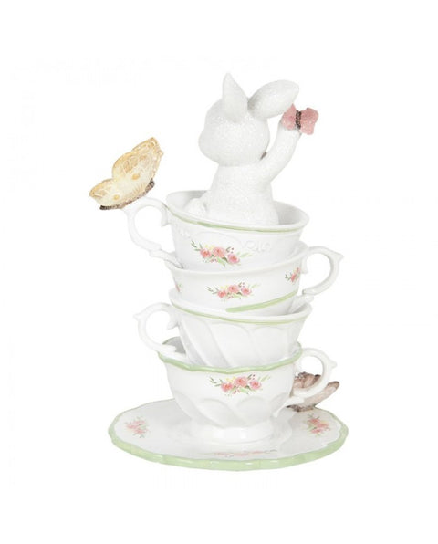 Figurine with cup and butterflies