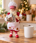 Babbo Natale pasticciere con casetta gingerbread alto 30 cm ambientato in cucina natalizia