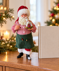 Babbo Natale giocattolaio con pennello alto 30 cm ambientato su mobile natalizio
