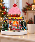 Carillon Cupcake Shop Goodwill 23 x 25 cm ambientato su consolle natalizia